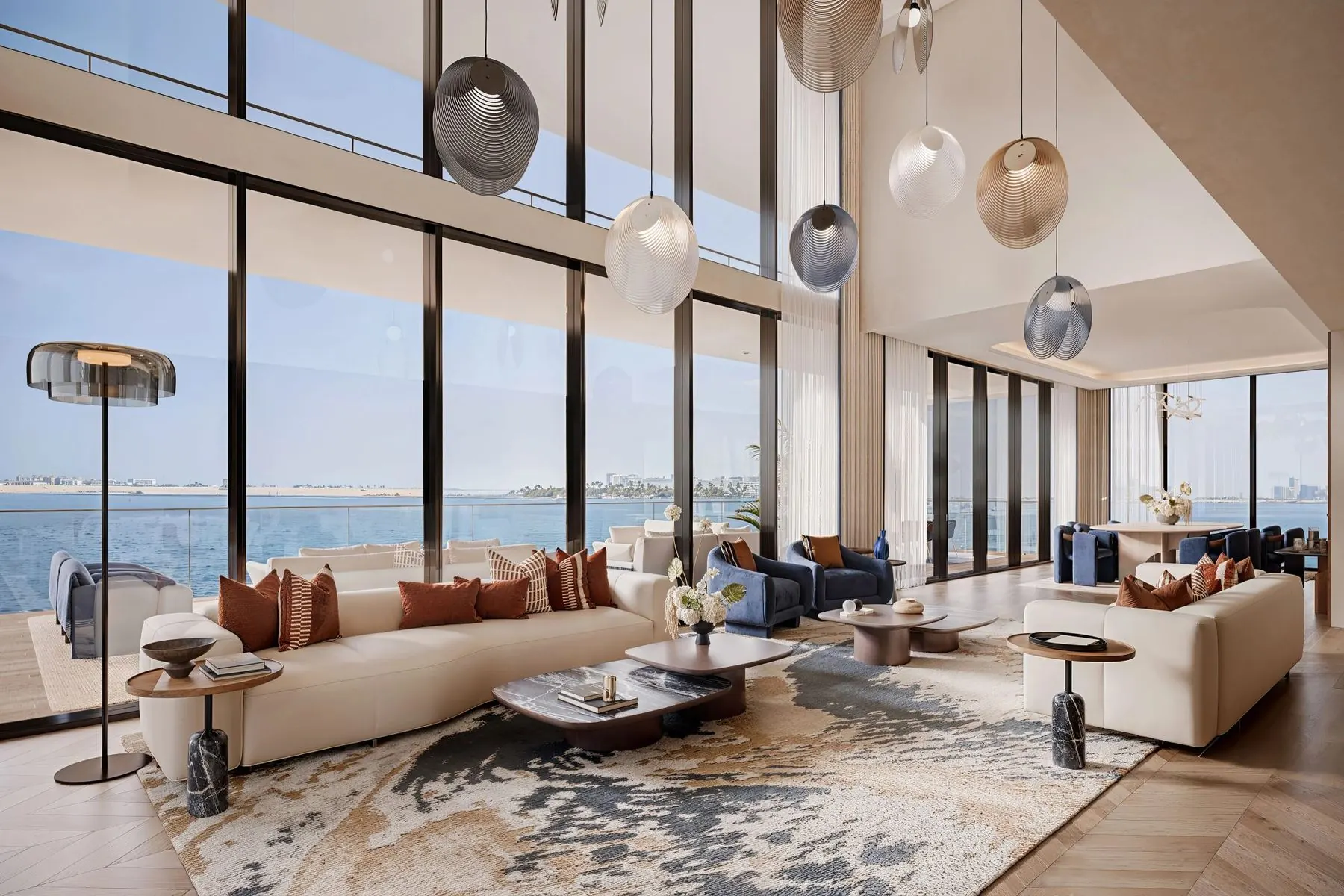 Double-height living room facing the water